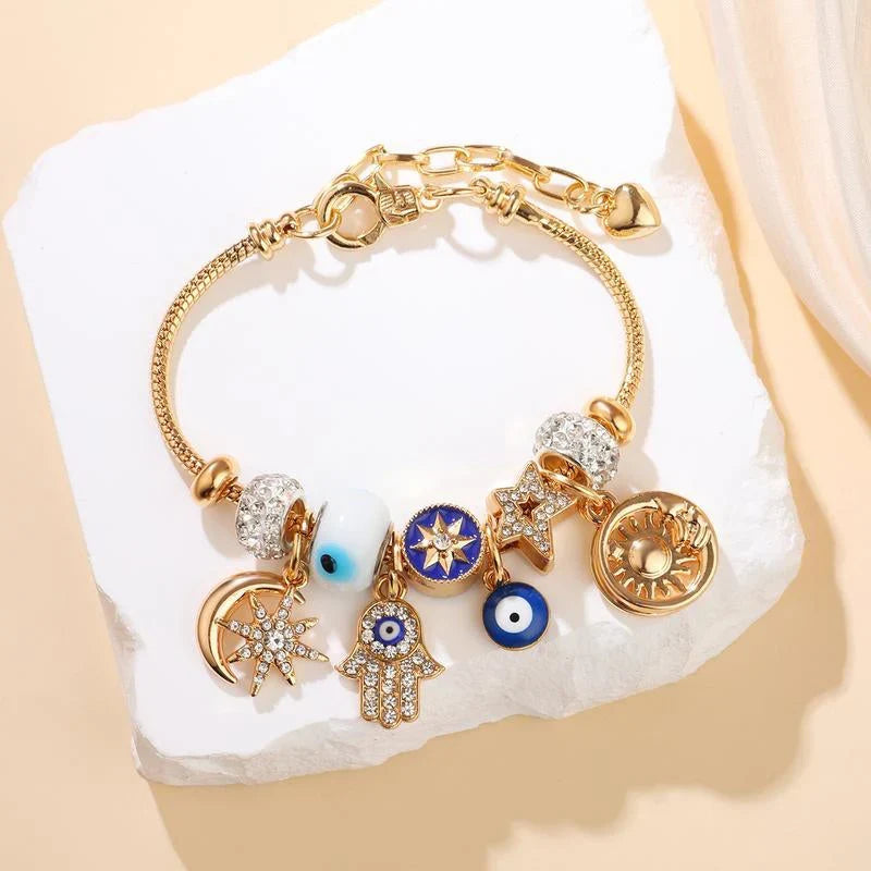 Stella – Verstelbare Hemelse Bedelarmband met Gouden Glans