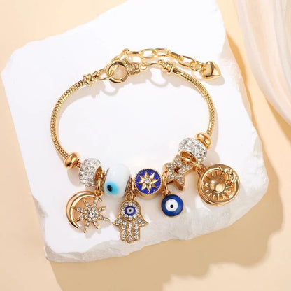 Stella – Verstelbare Hemelse Bedelarmband met Gouden Glans
