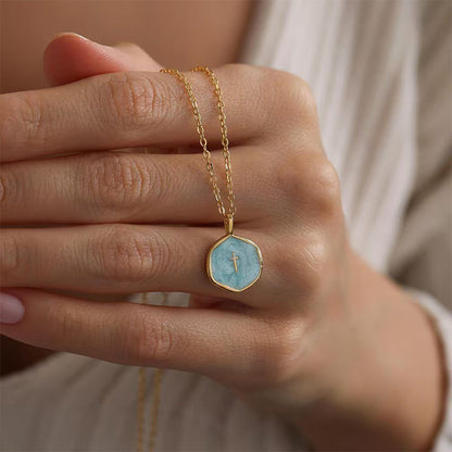Arianna – Ketting met kruis hanger van roestvrij staal met parelmoer glans