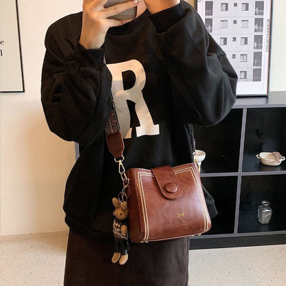 Vintage modetas met verstelbare riem